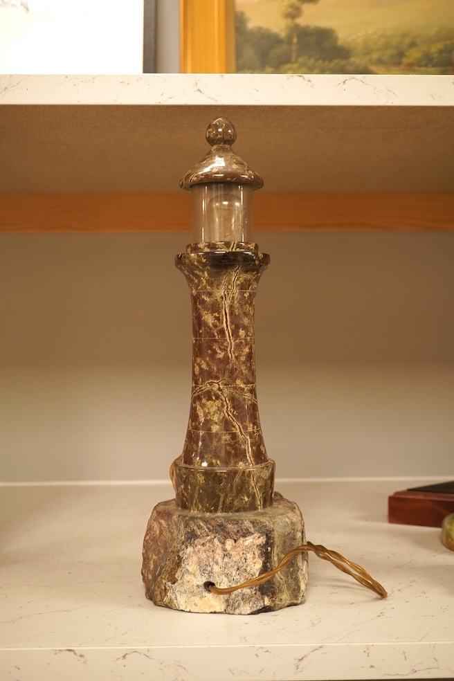 A serpentine lamp modelled as a lighthouse, 34cm high